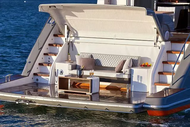 Slide: The Image of Luxury Schaefer 770 yacht deck with seating, table, and ocean view, 2026 model. - 25