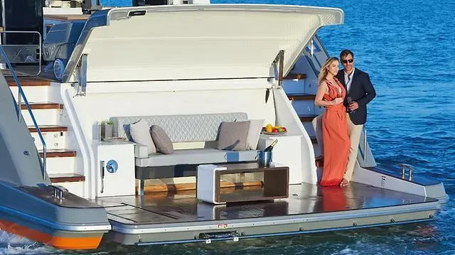 Slide: The Image of Couple enjoying luxury on Schaefer 770 yacht, 2026 model, with elegant deck seating. - 26