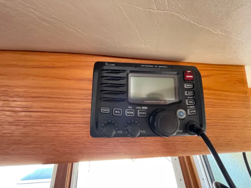 Slide: The Image of VHF marine radio on 2006 American Tug 34, mounted on wooden panel. - 24