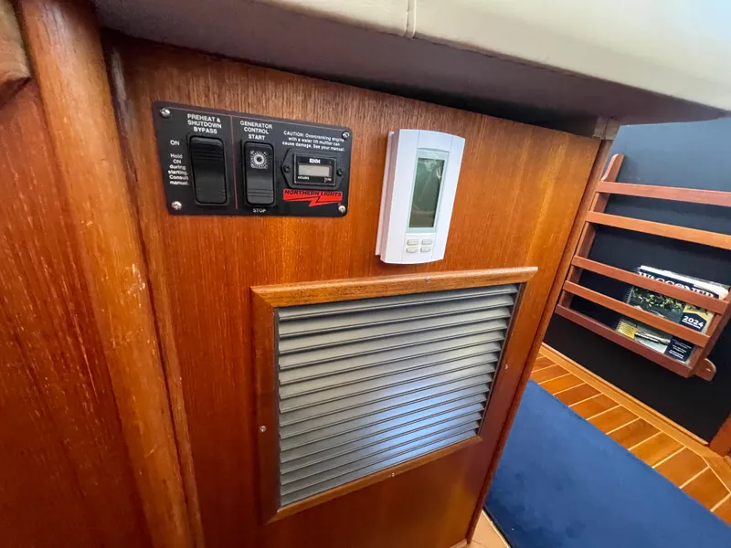 Slide: The Image of Control panel and thermostat inside a 2006 American Tug 34 boat cabin. - 29