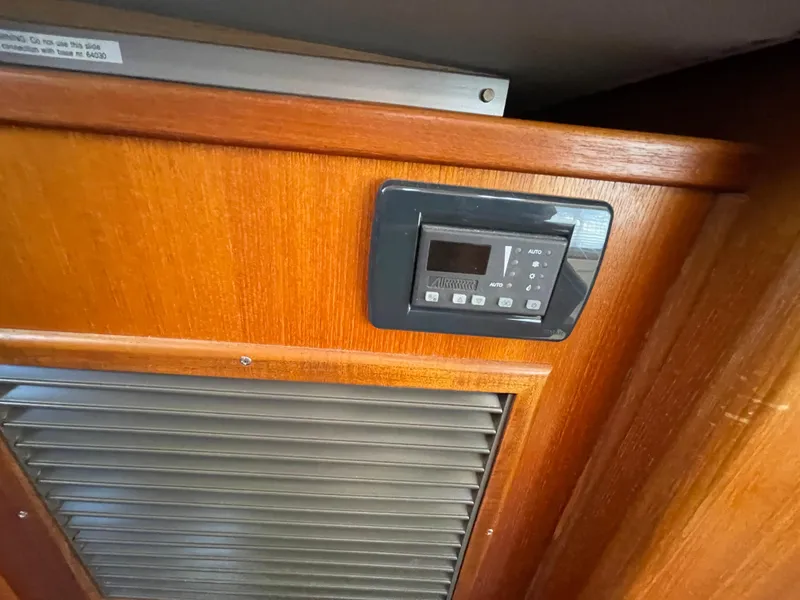 Slide: The Image of Control panel on 2006 American Tug 34 wooden interior. - 31