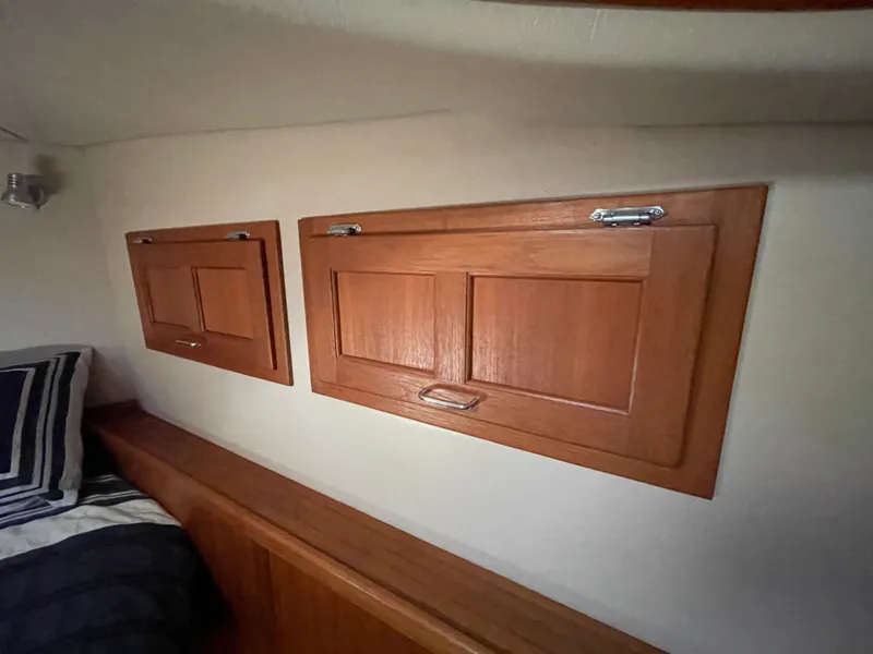 Slide: The Image of Wooden cabinets in a 2006 American Tug 34 interior cabin. - 43