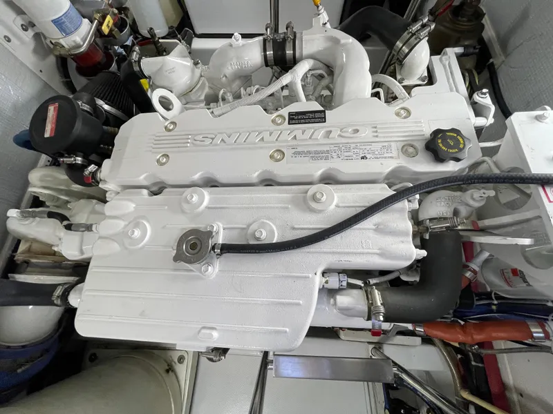 Slide: The Image of Engine of a 2006 American Tug 34, featuring a Cummins marine diesel engine. - 47