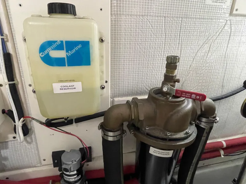 Slide: The Image of Coolant reservoir and sea strainer in 2006 American Tug 34 engine room. - 50