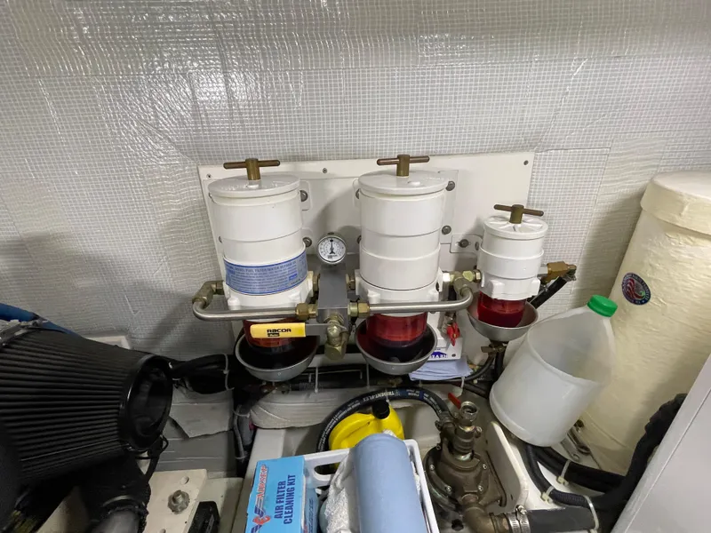 Slide: The Image of Engine room of 2006 American Tug 34 with fuel filters and maintenance supplies. - 51