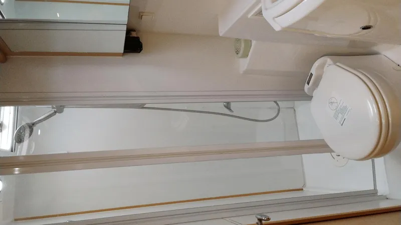 Slide: The Image of Bathroom interior of a 2008 Lagoon 420 yacht with shower and toilet. - 16