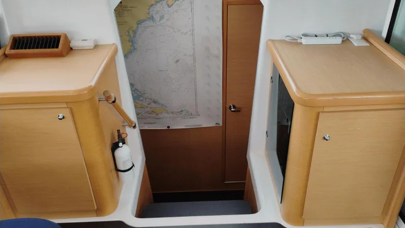 Slide: The Image of Interior of 2008 Lagoon 420 yacht with wooden cabinets and nautical map. - 18