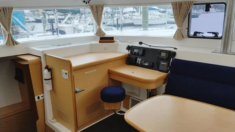 Slide: The Image of Interior of 2008 Lagoon 420 yacht with navigation station and seating area. - 21