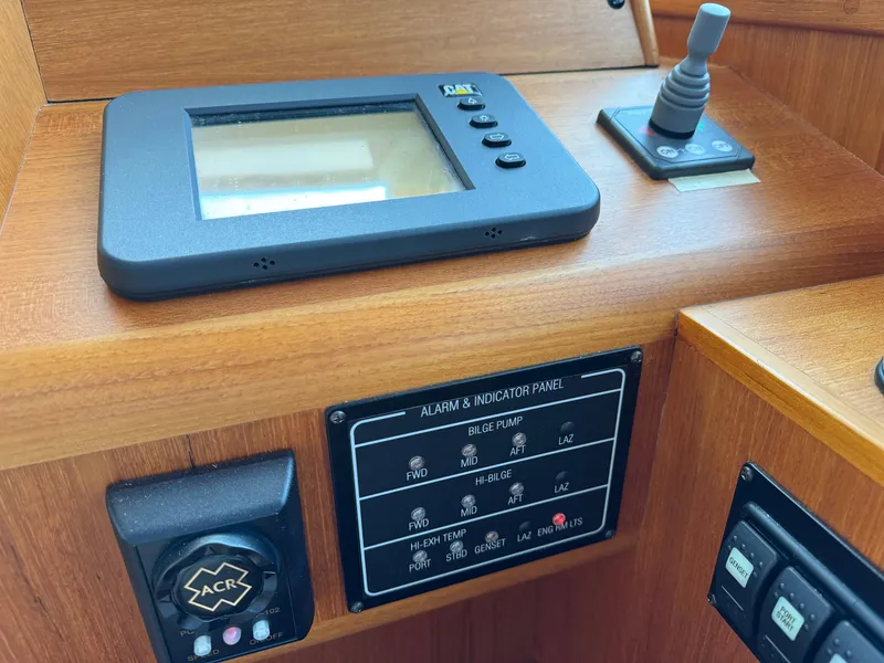 Slide: The Image of Control panel of 2009 Grand Banks 45 Eastbay SX with navigation and alarm systems. - 11