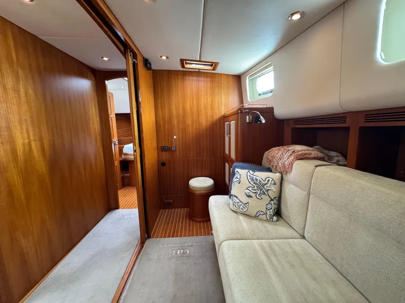Slide: The Image of Luxurious interior of 2009 Grand Banks 45 Eastbay SX yacht with wood paneling and cozy seating. - 35