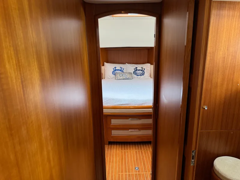 Slide: The Image of 2009 Grand Banks 45 Eastbay SX cabin with wooden interior and cozy bed. - 39