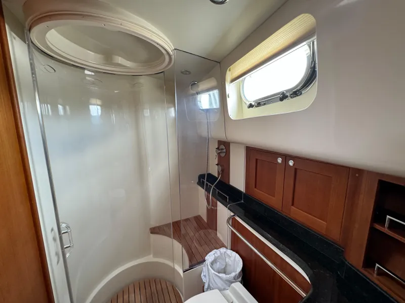 Slide: The Image of Luxurious bathroom in 2009 Grand Banks 45 Eastbay SX yacht with wooden accents and modern fixtures. - 46