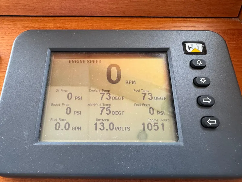 Slide: The Image of Digital engine display on a 2009 Grand Banks 45 Eastbay SX, showing various metrics. - 9