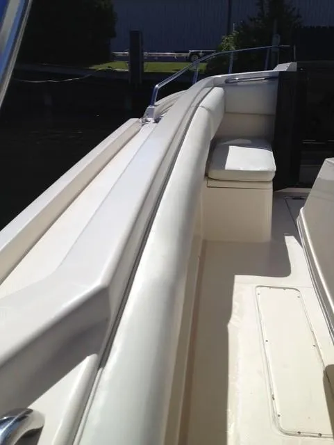 Slide: The Image of 1990 Donzi F-33 boat interior with white seating and sleek design. - 11