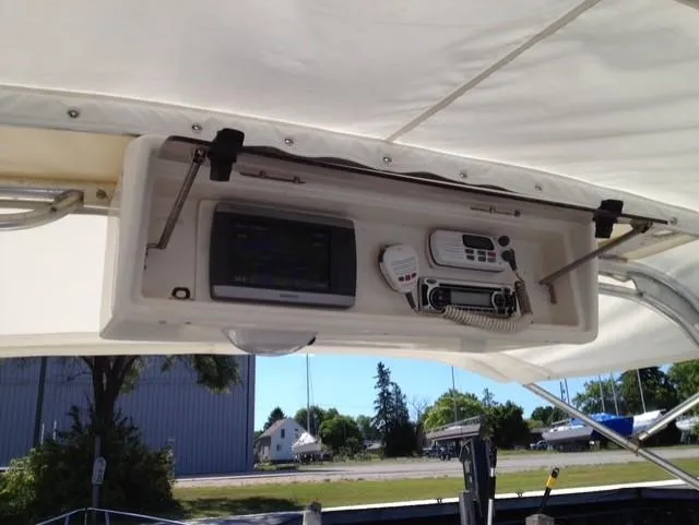Slide: The Image of 1990 Donzi F-33 boat dashboard with navigation and communication equipment. - 13