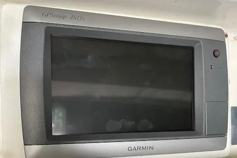 Slide: The Image of Garmin GPSmap 440s device on a 1990 Donzi F-33 boat dashboard. - 16
