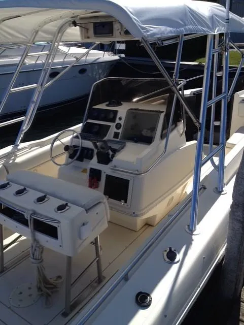 Slide: The Image of 1990 Donzi F-33 boat interior with steering console and seating. - 8