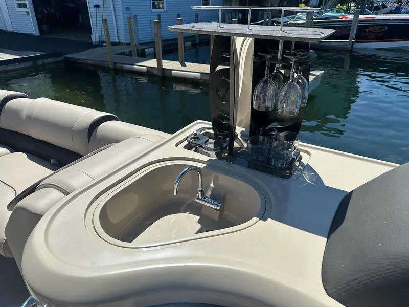 Slide: The Image of Luxurious 2018 Avalon Catalina Platinum Entertainer boat with bar setup and sink. - 15