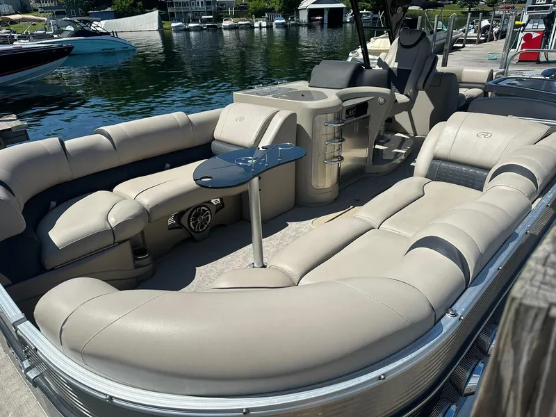 Slide: The Image of 2018 Avalon Catalina Platinum Entertainer boat with luxurious seating and sleek design at a dock. - 3