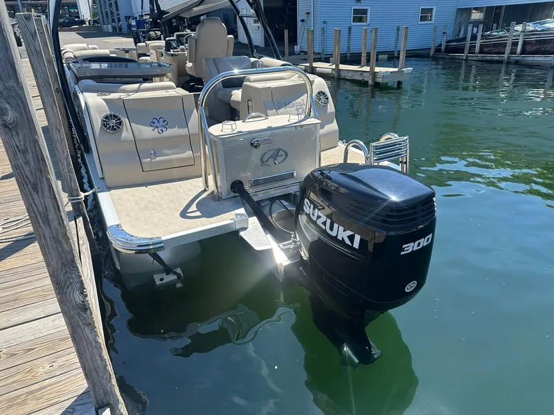 Slide: The Image of 2018 Avalon Catalina Platinum Entertainer boat with Suzuki 300 engine docked at marina. - 5
