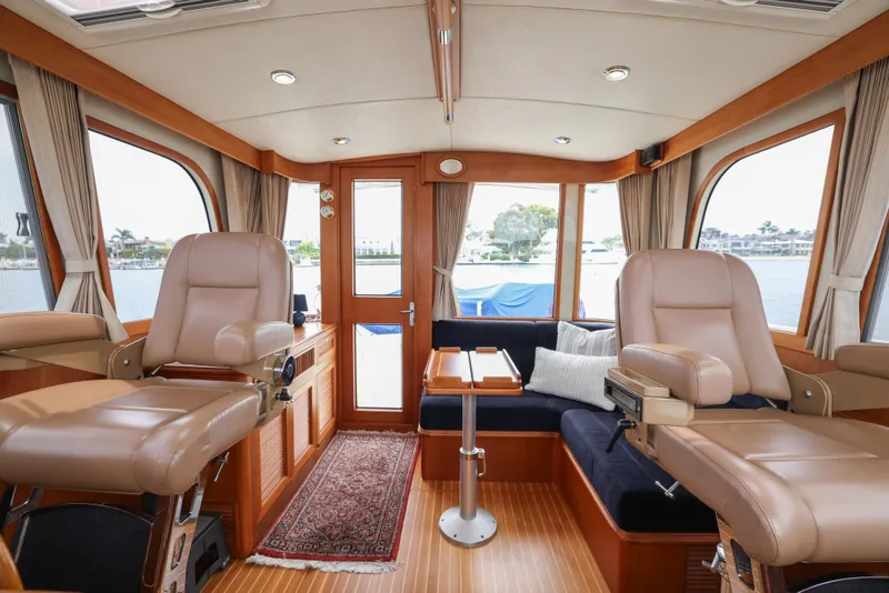 Slide: The Image of Interior of 2008 Grand Banks EASTBAY 39 SX yacht with luxurious seating and wood finish. - 16