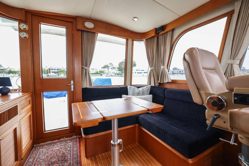 Slide: The Image of Luxurious interior of 2008 Grand Banks EASTBAY 39 SX yacht with elegant seating and wooden finishes. - 17