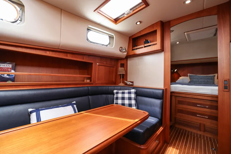 Slide: The Image of Luxurious 2008 Grand Banks EASTBAY 39 SX yacht interior with wood finish and cozy seating area. - 19