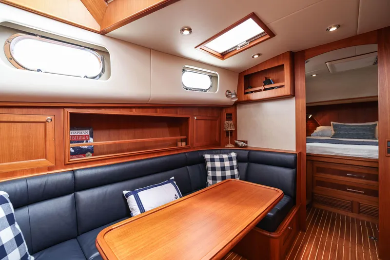 Slide: The Image of Luxurious interior of 2008 Grand Banks EASTBAY 39 SX yacht with wood finish and seating area. - 20