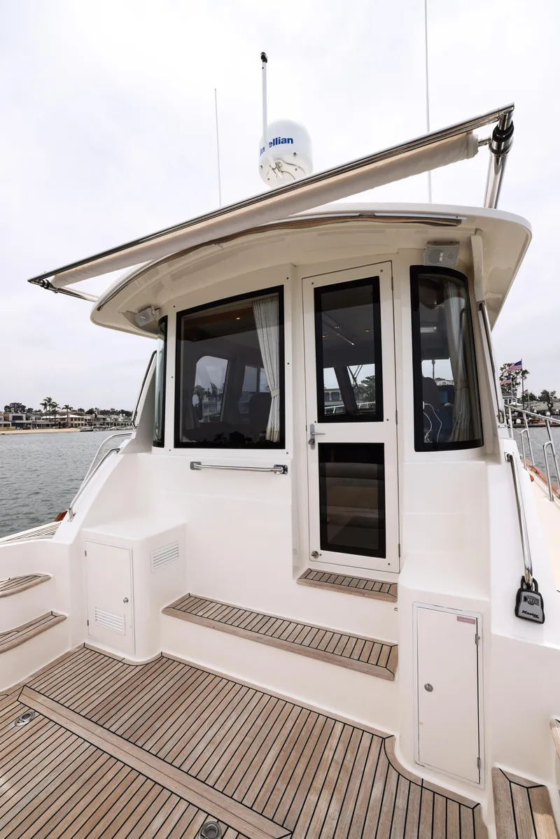 Slide: The Image of 2008 Grand Banks EASTBAY 39 SX yacht with teak deck and rear entrance. - 3