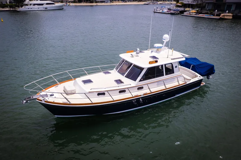 Slide: The Image of 2008 Grand Banks EASTBAY 39 SX yacht on calm water, showcasing sleek design and luxury. - 35