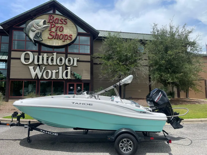 Slide: The Image of 2025 Tahoe T16 boat on trailer outside Bass Pro Shops Outdoor World. - 5