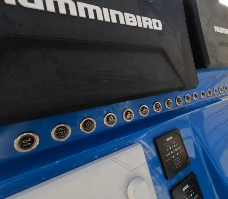 Slide: The Image of Outboard motor on 2022 Eastward 30 boat, with railing, on calm water. - 14