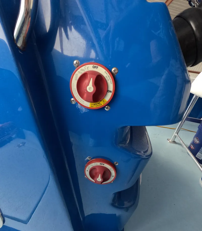 Slide: The Image of Steering console of 2022 Eastward 30 boat with navigation screens and controls. - 18