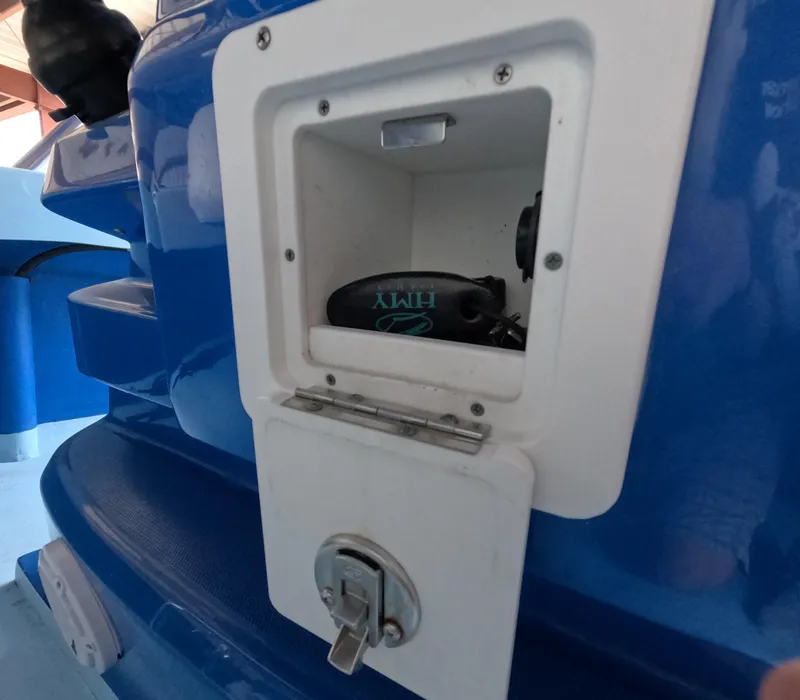 Slide: The Image of Interior view of 2022 Eastward 30 boat with blue seating and navigation equipment. - 21