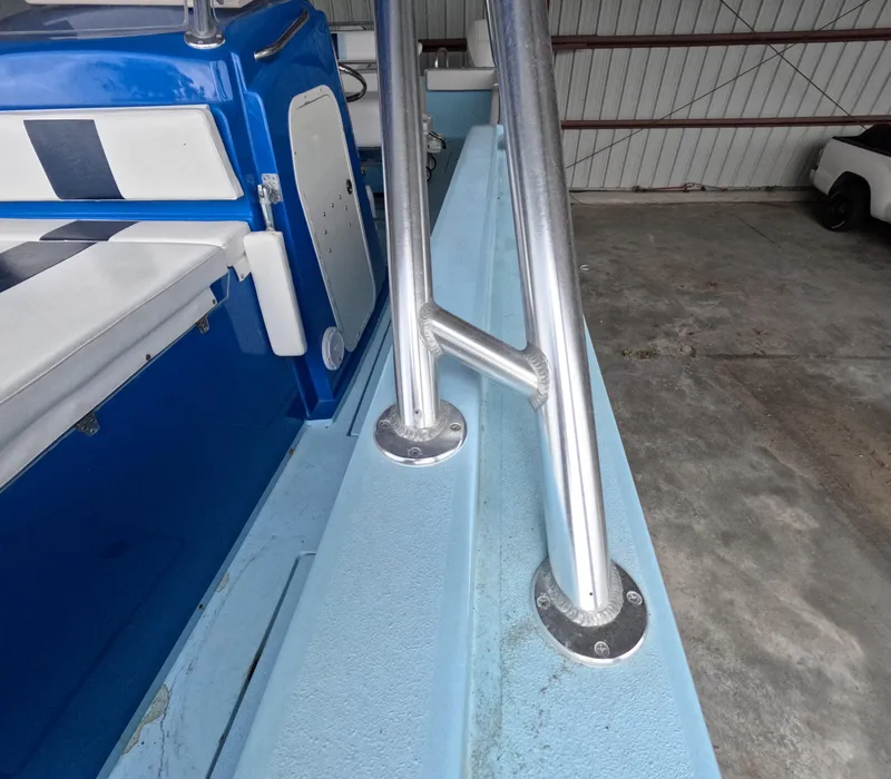 Slide: The Image of 2022 Eastward 30 boat cruising on a calm lake with scenic shoreline. - 31