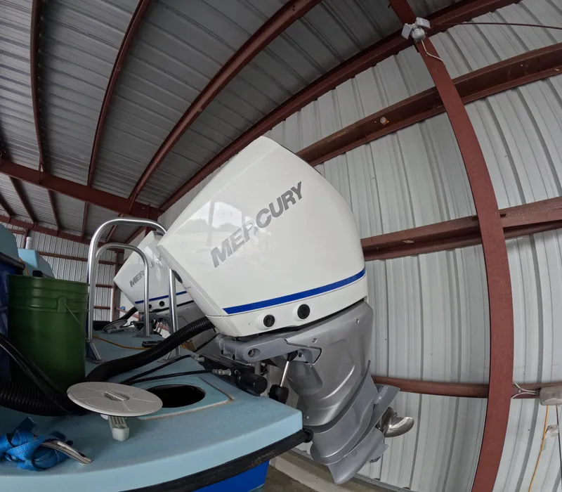 Slide: The Image of Blue 2022 Eastward 30 boat named "Cool Change" on calm water. - 35