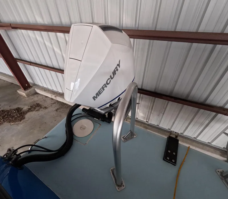 Slide: The Image of Blue 2022 Eastward 30 boat named "Cool Change" cruising on calm water. - 37