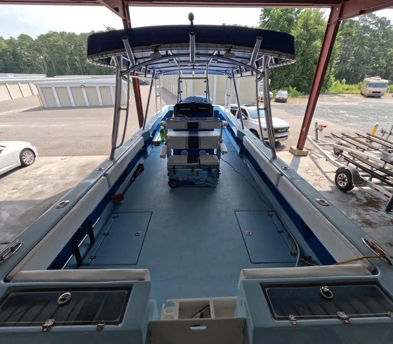 Slide: The Image of Open deck of 2022 Eastward 30 boat with scenic waterfront view. - 9