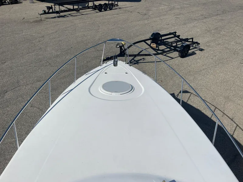 Slide: The Image of 1998 Cruisers 2870 Rogue boat deck with trailer in parking lot. - 19