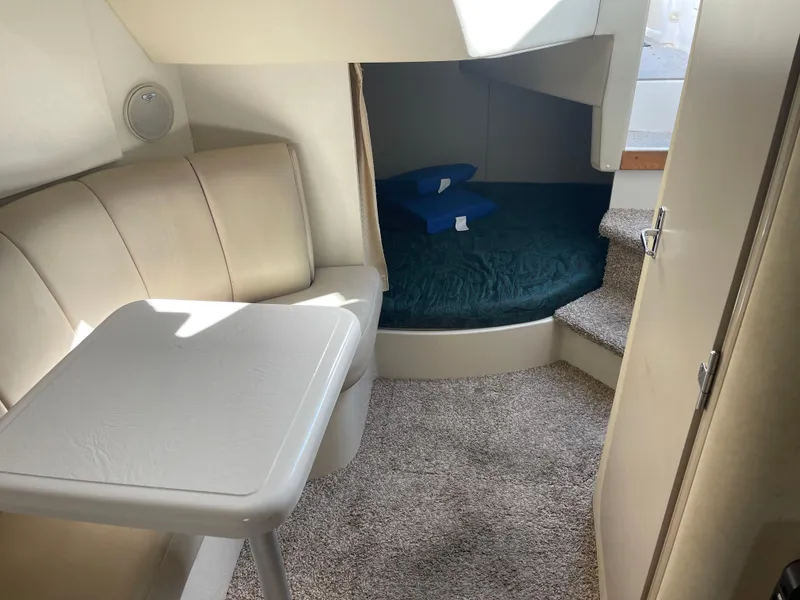Slide: The Image of Interior of 1998 Cruisers 2870 Rogue boat with seating and sleeping area. - 28