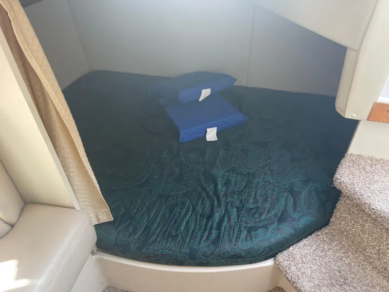Slide: The Image of Interior cabin of 1998 Cruisers 2870 Rogue with bed and pillows. - 30
