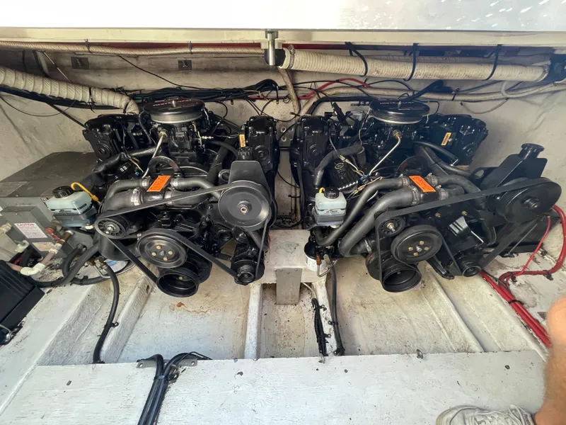 Slide: The Image of Twin engines in a 1998 Cruisers 2870 Rogue boat, showcasing mechanical components. - 38