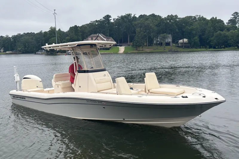Slide: The Image of 2021 Grady-White 251 Coastal Explorer boat on a calm lake. - 0