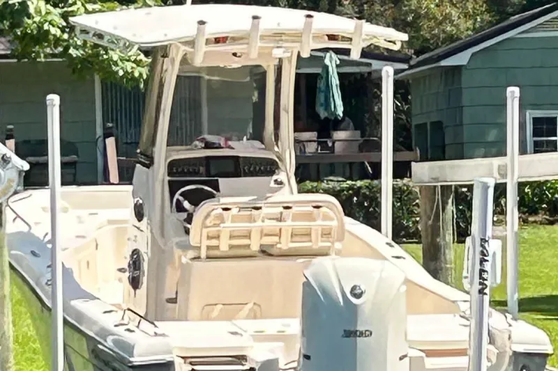 Slide: The Image of 2021 Grady-White 251 Coastal Explorer boat docked near a house. - 11