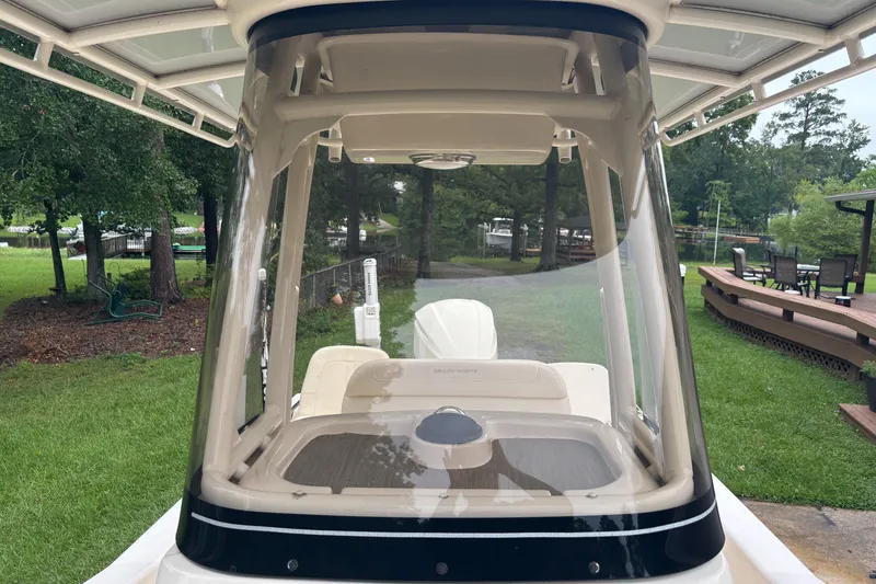 Slide: The Image of 2021 Grady-White 251 Coastal Explorer boat with clear windshield, dockside view. - 23