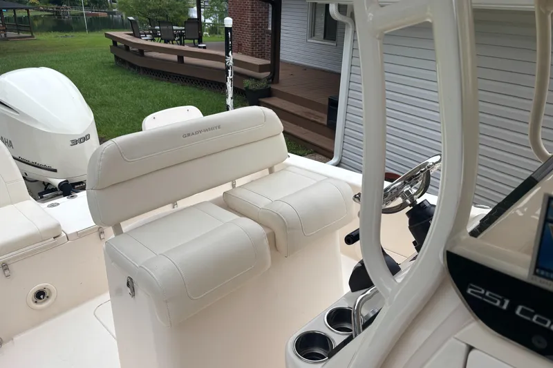 Slide: The Image of 2021 Grady-White 251 Coastal Explorer boat interior with seating and Yamaha 300 engine. - 25