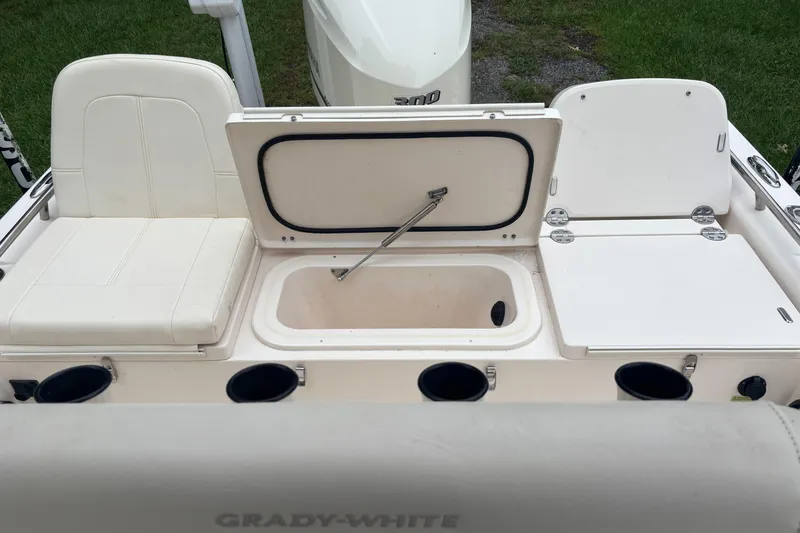 Slide: The Image of 2021 Grady-White 251 Coastal Explorer boat interior with seating and storage compartments. - 27