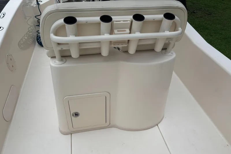 Slide: The Image of 2021 Grady-White 251 Coastal Explorer boat seat with rod holders and storage compartment. - 28