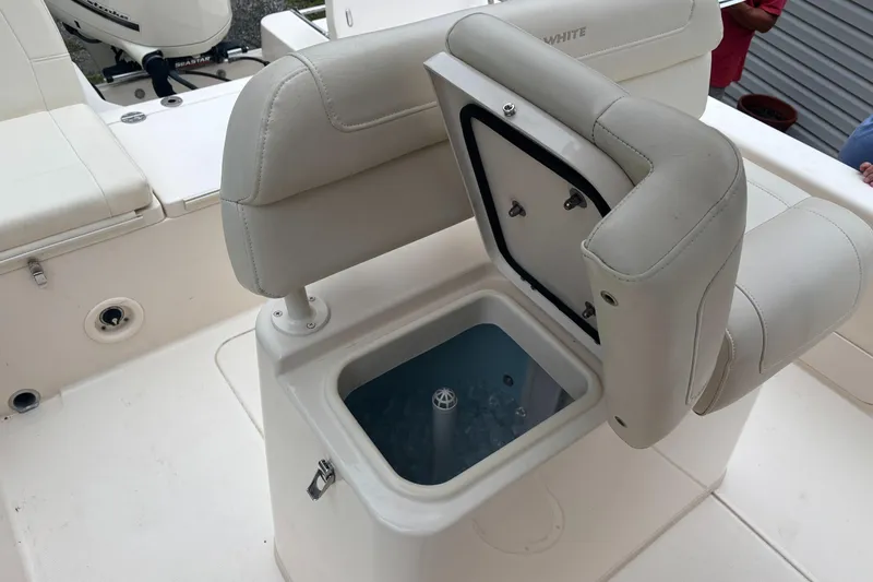 Slide: The Image of 2021 Grady-White 251 Coastal Explorer boat with open storage compartment. - 29