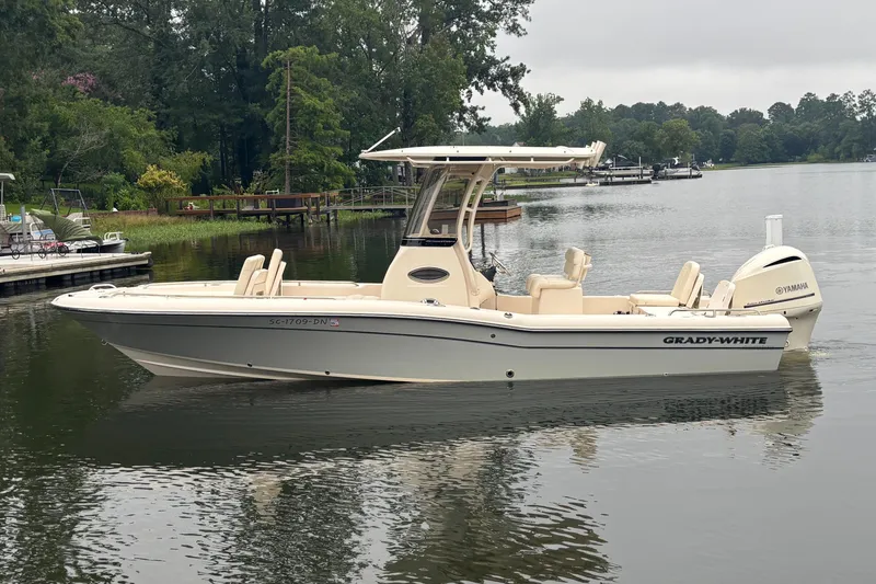 Slide: The Image of 2021 Grady-White 251 Coastal Explorer boat on a calm lake. - 35